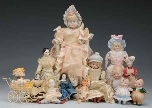Lot of 13: Assorted Dolls.: Description The largest doll is a reproduction doll with a molded bonnet and lot also includes another reproduction with a molded mop cap. Other items in lot consist of one antique shoulder head with 