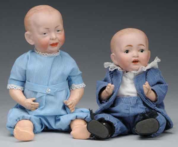 Lot of 2: Small Bisque Head Character Babies.: Description Includes one Kammer & Reinhardt, so called, Kaiser Baby with head incised "28K*R100", molded and painted features, and original body. Some wear to arms and a chip to one toe. Also includes