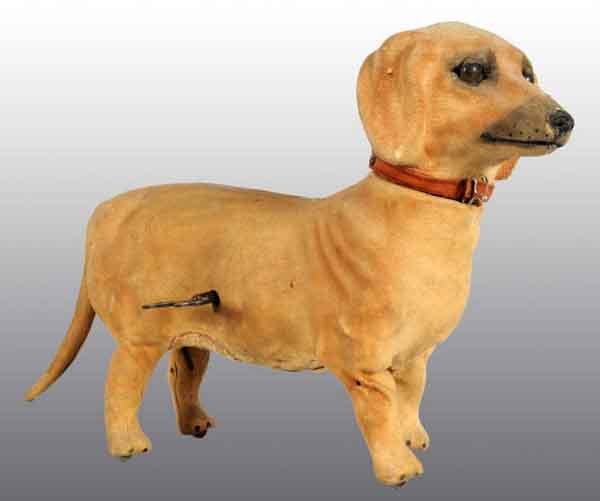 De Camp Clockwork Dachshund Dog Toy.: Description Soft cloth covered. Working. When wound, dog walks, turns head, and barks. Key is present. Condition (Excellent). Size 11" x 9".