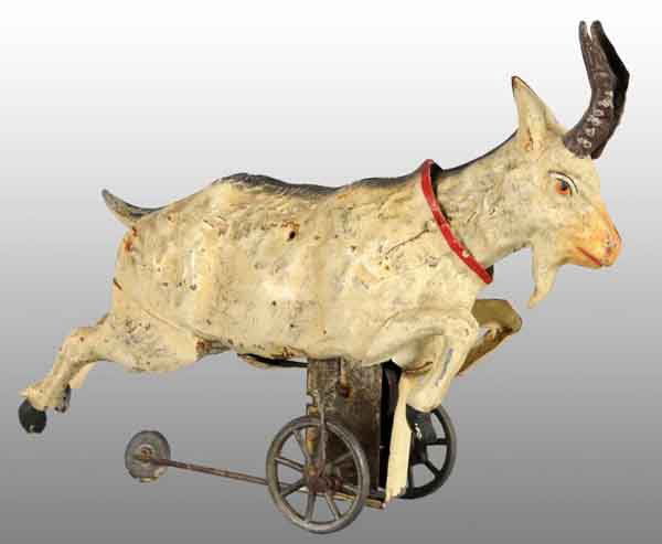 Tin Hand-Painted Goat Wind-Up Toy.: Description German. Working. When wound, goat rolls forward on three wheels on bottom, including a guide wheel, while his head goes up and down. Some minor wear. Condition (Excellent). Size 7" L.