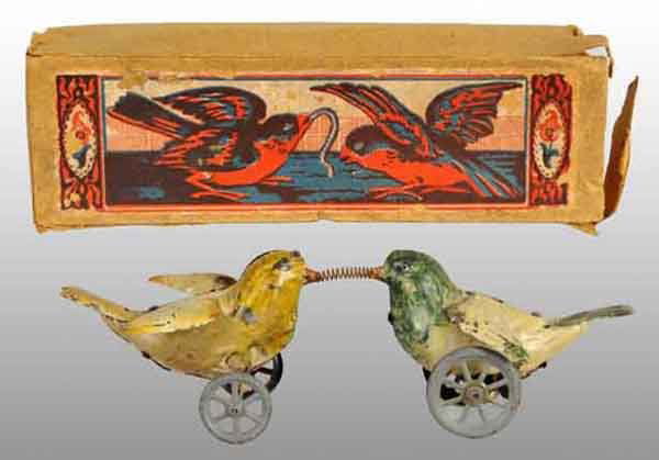 Tin Hand-Painted Birds Fighting Wind-Up Toy.: Description German. Working. When wound, wheels on bottom of birds make them go back and forth while fighting over coiled spring which represents worm. Extremely nice condition for this type of toy wi