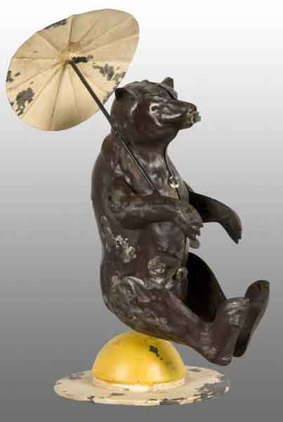 Tin Hand-Painted Bear Wind-Up Toy.: Description German. Working. When wound, bear spins around tin base. Appears to be all original. Stamped "Made in Germany" on bottom of base. Some minor to moderate paint chipping throughout toy with