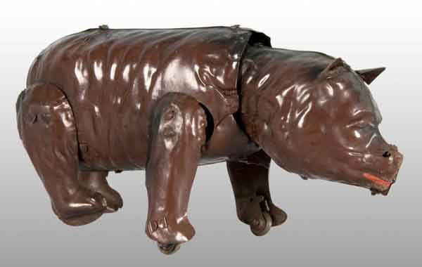 Tin Hand-Painted Bear Wind-Up Toy.: Description German. Working. Original ears. When bear is wound, he walks forward with two wheels under front legs. Minor wear. Condition (Excellent). Size 6" L.