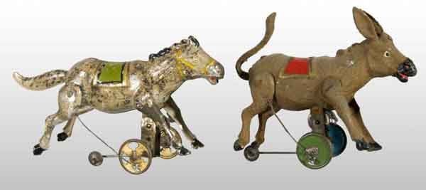 Lot of 2: Tin Hand-Painted Wind-Up Toys.: Description German. Working. Both are operated with three wheels on bottom, which includes one guide wheel. One horse and one donkey. When wound, both donkeys kick back legs and roll forward. One is a