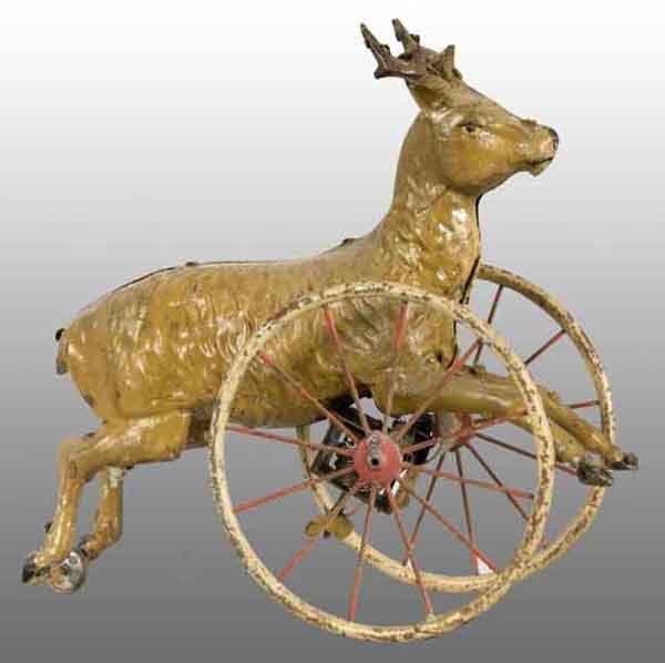 Tin Hand-Painted Stag Wind-Up Toy.: Description German. Working. When wound, large wheels roll stag forward while a third small wheel between hind legs in back acts as a guide. Unusually large size for this scarce toy. Minor to moderate