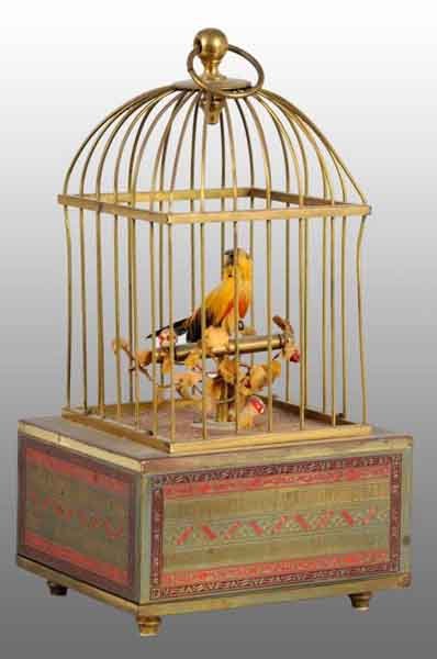 Tin Birdcage Wind-Up Toy.: Description German. Marked "Made in Germany Kenlo" on bottom. Bird looks realistic with feathers and sounds realistic. When wound, toy chirps like a real bird. A little more elaborate than your normal