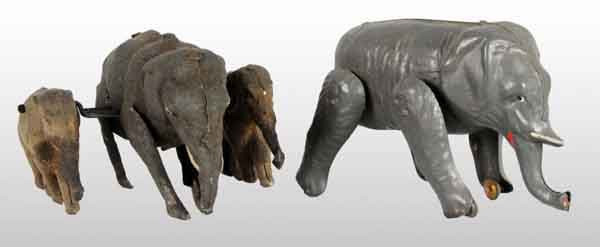 Lot of 2: Tin Hand-Painted Elephant Wind-Up Toys.: Description Early German. One is a single elephant with wheels on front to facilitate walking when wound and second is an extremely unusual and scarce toy of mother elephant walking with one baby elep