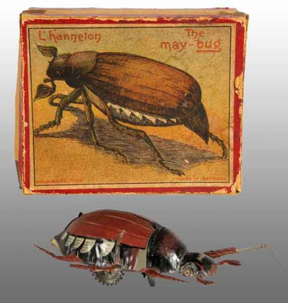 Tin Litho May Bug Wind-Up Toy.: Description German. Working. Marked "Made in Germany". Toy has minor wear. Includes original box with beautiful and some early color paper label, splitting to box seams, and some creasing. Condition (