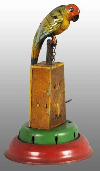 Tin Litho Parrot Wind-Up Toy.: Description German. Working. Marked "JDN Germany" on parrot. When wound, bird goes up and down, wings flap, and bellows underneath base makes a squeaking noise. Moderate wear throughout. Condition (Ve