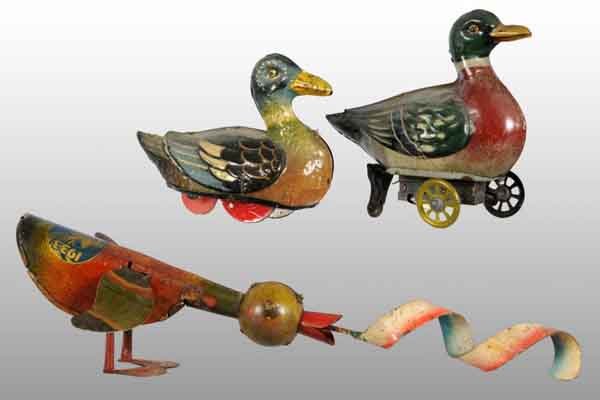 Lot of 3: Tin Litho Duck Toys.: Description German. Working. Includes a wind-up duck with metal ribbon in mouth depicting worm and 1933 "A Century of Progress" Chicago World's Fair sticker on back. Second is a wind-up duck and last 