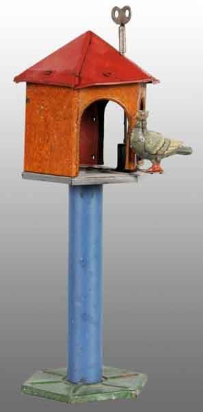 Tin Litho Pigeon & Birdhouse Wind-Up Toy.: Description German. Working. When wound, three-inch long lithographed pigeon revolves in and out of birdhouse. Unmarked with some moderate rust throughout toy. Condition (Good - Very Good). Size 9" T.