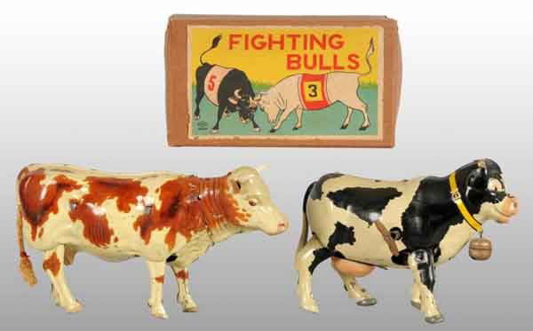 Lot of 3: Tin Bull & Cow Wind-Up Toys.: Description German and Japanese. Working. Includes one fighting bulls toy on platform with nice lithography and original horns, one walking cow toy with original bell, and one walking "Made in US Zone