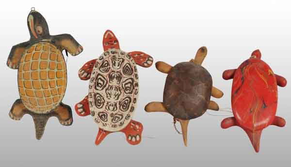 Lot of 5: Turtle Pull Toys.: Description American. Includes one paper on wood, three different variations of painted wood, and one tin. One marked "Tick Tock Toys Firestone" on bottom of head. Moderate overall wear. Not all pictu