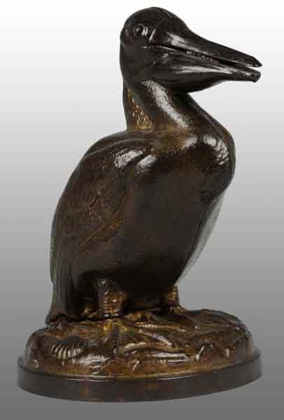 Cast Iron Pelican with Mammy Mechanical Bank.: Description Manufactured by Trenton Lock and Hardware Company. Working. Condition (Excellent Plus).