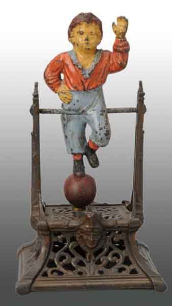 Cast Iron Boy on Trapeze Mechanical Bank.: Description Manufactured by Barton & Smith. Condition (Excellent).