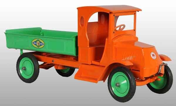 Pressed Steel American National Dump Truck Toy.: Description Circa 1925. Enclosed Bulldog Mack front cab with crank handle that operates the rear dump body and opening tailgate. Complete restoration to an all original toy. Condition (Restored). Size