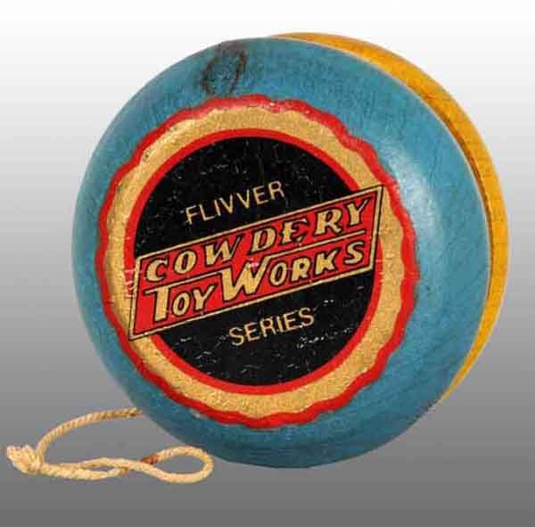 Wooden Cowdery Toy Works Yo-Yo Toy.: Description Beautiful decals on both sides that say "Flivver Series Cowdery Toy Works". Some age cracking underneath of decals. Condition (Very Good). Size 2" Dia.