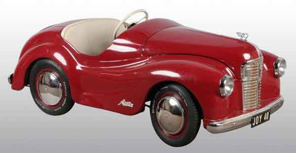 Pressed Steel Austin J40 Triang Pedal Car.: Description English. 1950s. Opening hood and trunk with working headlights. Very large car. Professionally restored. Condition (Restored). Size 58" L.