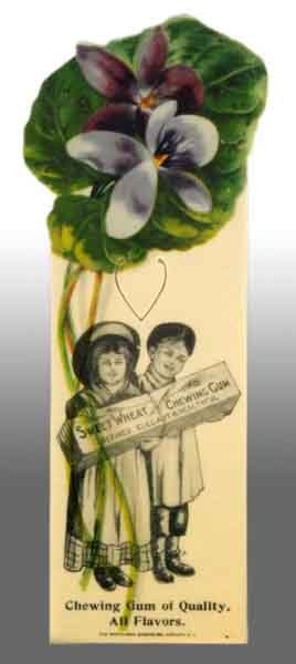 Celluloid Sweet Wheat Gum Bookmarker.: Description Depicts two children holding a pack of gum. Nice piece. Condition (Very Good - Excellent). Size 4 - 1/4" T.