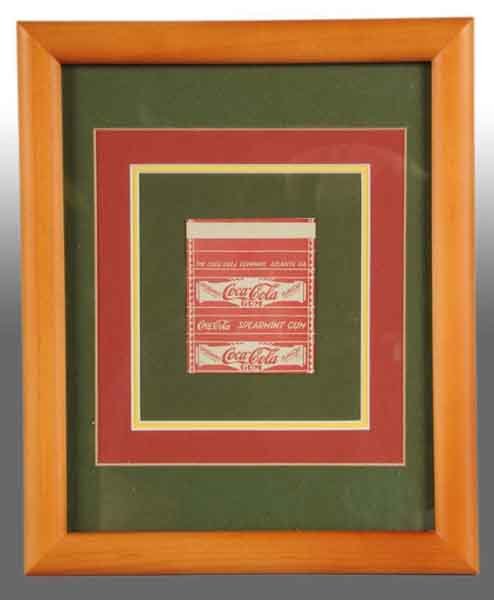 Framed Coca-Cola Gum Wrapper.: Description This gum wrapper is cited as being unreleased. Condition (Excellent). Size Wrapper: 3 - 1/8" x 2 - 3/4".