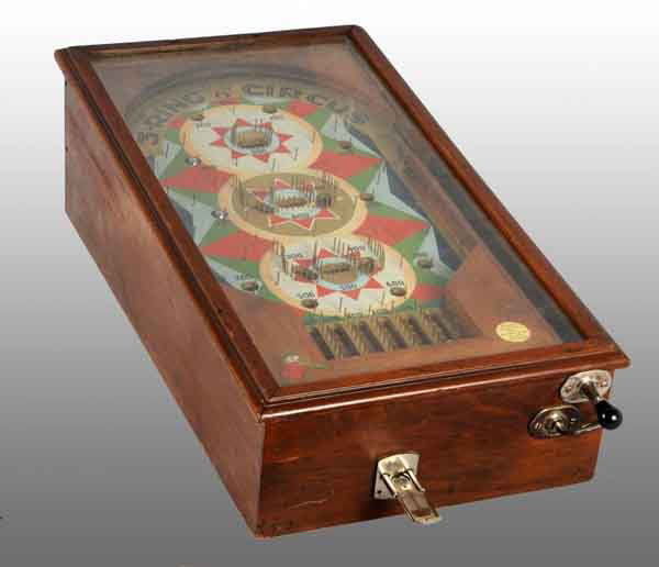3-Ring Circus Tabletop Pinball Machine.: Description Circa 1930s to 1940s. Made by the Vending Machine Company in Fayetteville, North Carolina. Operates on a penny and keys are included. Nice overall condition with only mild to moderate wear