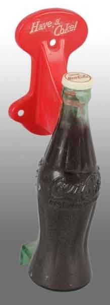 Plastic Coca-Cola Bottle Door Pull.: Description 1950s. Nice and bright with only very minor marks. Condition (9.0 - 9.5, Near Mint). Size 7 - 1/2" T.