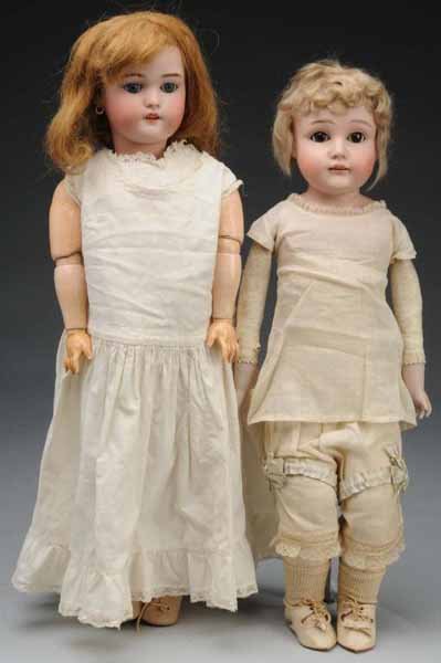 Lot of 2: Rare German Bisque Girls.: Description Ca. 1910. Bisque shoulder head incised "11" only, but an early model made by J. D. Kestner, large brown sleeping eyes, open mouth with four upper square-cut teeth, plaster dome and origina
