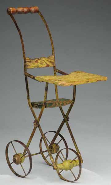 Early Metal & Wood Stroller/Highchair Combination.: Description Ca. 1900. Original green paint (some wear, piece broken from tray). Great form, wonderful accessory for an antique doll. Condition (Very Good). Size 21" T.