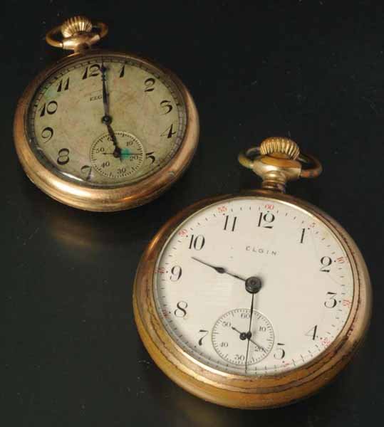 Lot of 2: Elgin Open Face Pocket Watches.: Description Working. Includes one 20 and one 25 year case. Condition (Excellent). Size Largest: 2" Dia.