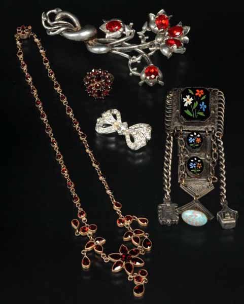 Lot of 5: Antique Jewelry Pieces.: Description Includes three pins, one ring, and one necklace. Both the size five ring and necklace have garnets. The pins consist of one bow pin by Trifari, one pin marked "H. Pomerantz of NY" with ena