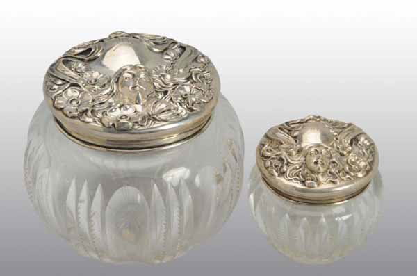 Lot of 2: Cut Glass Art Nouveau Vanity Jars.: Description Matching jars all marked "Sterling". High relief decoration. No damage, cracks, or chips. Condition (Excellent). Size Largest: 2 - 3/4" T.