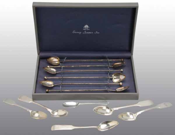 Lot of 12: Spoons.: Description Includes six heart shaped Georg Jensen teaspoons and six coin silver spoons with hallmarks. One teaspoon is made of pewter but the others are all silver. Condition (Excellent).