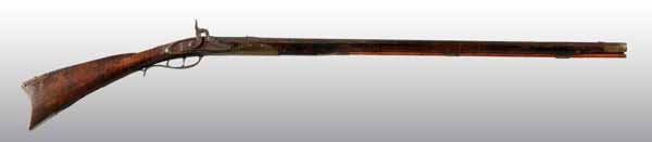 Kentucky Rifle.: Description OL: 49". BL: 33". TB: Octagon to round. LM: Percussion. PB: None. S: Curly Maple. Incise carving. Two brass inlays. This Kentucky fowler was shortened at the breech end and converted to pe