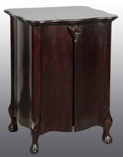 Reginaphone Serpentine Cabinet.: Description Includes 11 discs. Condition (Excellent). Size 15 - 1/2".