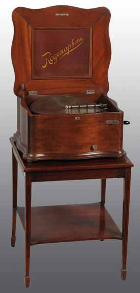 Reginaphone Serpentine Case Disc Music Box.: Description Refinished. Case in mahogany with table, 44 discs, and No. 78 parts. Working. Condition (Refinished). Size 15 - 1/2".
