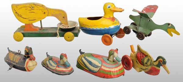 Lot of 7: Tin & Wooden Duck Toys.: Description American and English. Working. Includes four wind-up toys, two push toys, and one stick toy missing its stick. Several of the toys are made by Wyandotte. Moderate overall wear. Condition