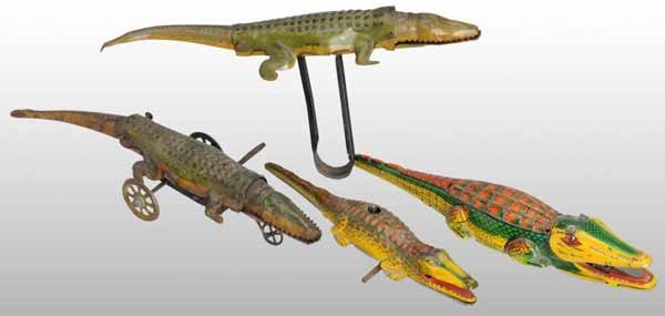 Lot of 4: Tin Litho Alligator Toys.: Description German. Working. All are marked "Germany" and one was made in US Zone. Includes three wind-up and one handheld squeeze toy. Moderate overall wear. Condition (Very Good - Excellent). Size A