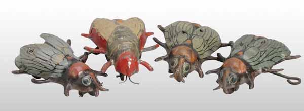 Lot of 4: Tin Fly Wind-Up Toys.: Description German. Working. Includes one hand-painted and three lithographed toys. Moderate overall paint loss and wear. Condition (Very Good). Size All: 4 - 1/2" L.