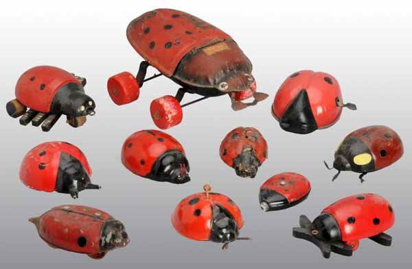 Lot of 11: Lady Bug Toys.: Description American and German. Tin, plastic, and composition. Most are friction or pull toys but one is a flashlight marked "Germany" on the bottom. Moderate overall wear. Condition (Very Good). Siz