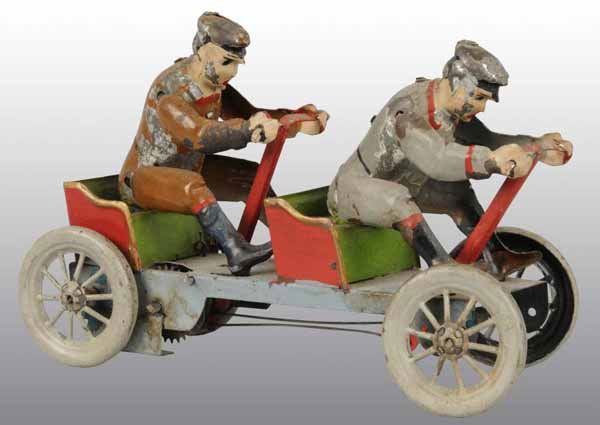 Tin Hand-Painted Double Irish Male Wind-Up Toy.: Description German. Working. When wound, men pull back and forth on handles. Moderate paint flaking on figures. Condition (Very Good). Size 9" L.