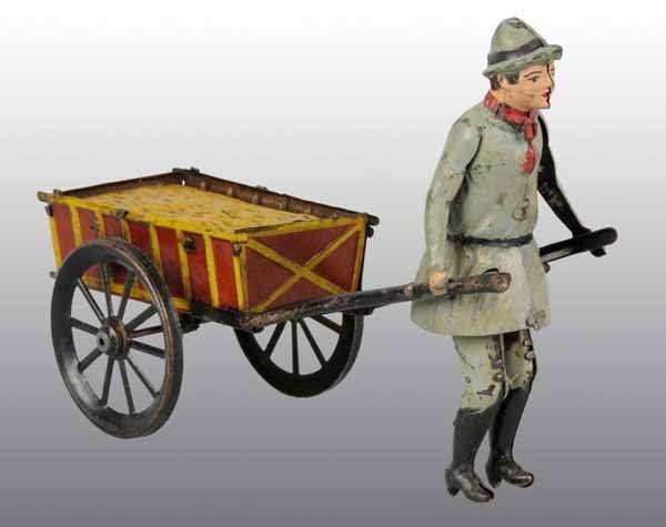 Tin Hand-Painted Man Pulling Hay Cart Wind-Up Toy: Description German. Working. Cart is lithographed and van is a combination of hand-painting and litho. Some paint touchup on figure. Condition (Very Good). Size 8" L.