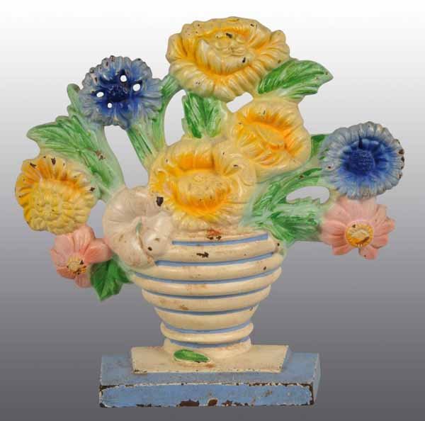 Cast Iron Hubley Marigolds Doorstop.: Description Marked, "Made in USA, 315". Condition (Very Good). Size 7 - 3/4" x 8".