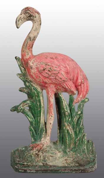Cast Iron Flamingo Doorstop.: Description Made by Hubley, cat. #450. Full-figure with realistic depiction of a flamingo standing amongst reeds. One of the rarer forms of doorstop produced by Hubley. Very good. 700-1000 Condition (