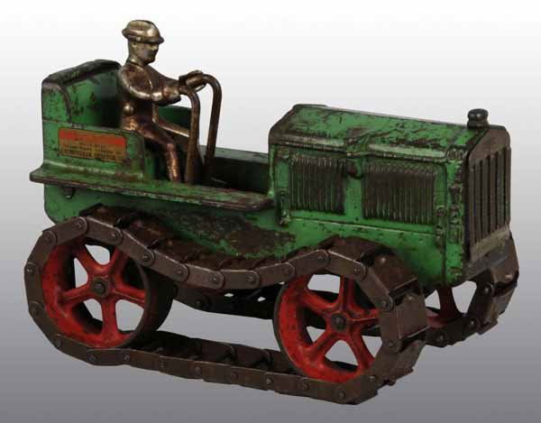 Cast Iron Caterpillar Tractor Toy.: Description All original with metal wheels and track. Includes a plated driver. Some rusting throughout. Condition (Very Good). Size 9" L.