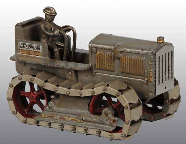 Cast Iron Arcade Caterpillar Tractor Toy.: Description Rare. All original with gray and gold highlighting. "TEN" variation with metal wheels. Arcade label is present on rear of tractor. Figure is included. Provenance: Dick Ford Collection.