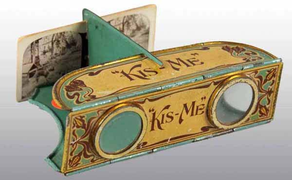 Tin Kis-Me Stereoscope.: Kis-Me Gum from American Chicle Co., Louisville, KY. Includes five stereo views. Vintage piece with minimal wear. 1 - 1/4" x 4 - 1/4" x 3 - 1/4".