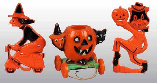 Lot of 3: Plastic Halloween Toys.: Includes cat holding pumpkin figure, witch on bike toy and a pumpkin candy container. Largest: 3" T.