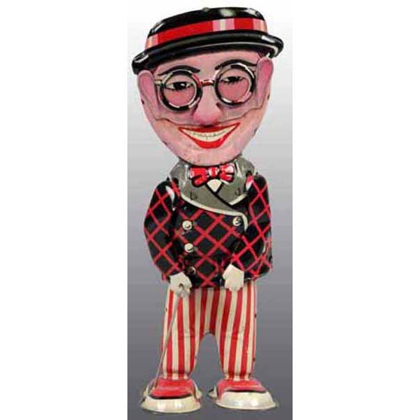 Pre-War Japan Harold Lloyd Funny Face Wind-Up Toy: Circa 1932. Working. This is the pre-war Japanese version of the moving face walking tin toy. It is identical in every respect to the Louis Marx toy except for the colors. As with most other pre-war J