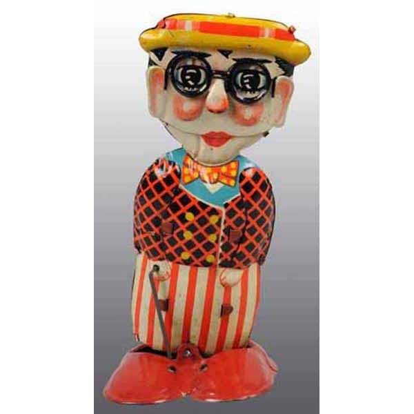 Pre-war Japan Harold Lloyd Funny Face Tin Wind-Up: German. Circa 1920s. Working. Adapted by Louis Marx Company and became the basis for the Marx series of walking toys. When wound, mouth and eyes move. Includes original cane. Scarce and beautiful toy.