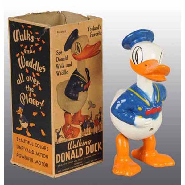 Walt Disney Donald Duck Wind-Up Toy in Orig Box.: Composition. Manufactured by Lewis and Scot Manufacturing Company. When wound, Donald waddles back and forth. Marked "Walt Disney Enterprises" on rear of toy. Nice, bright, and shiny with very little 